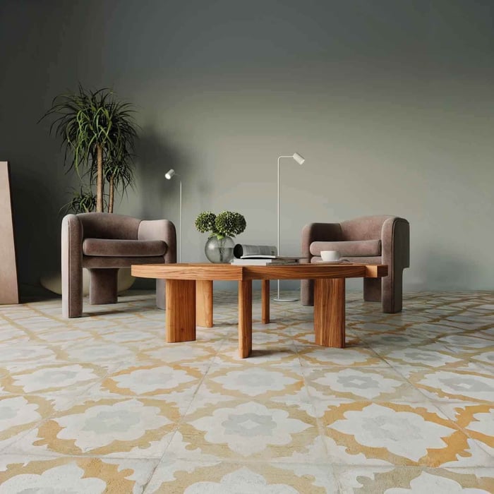 Modern living room with two chairs, wooden coffee tables, and slim white floor lamps against a muted green wall.