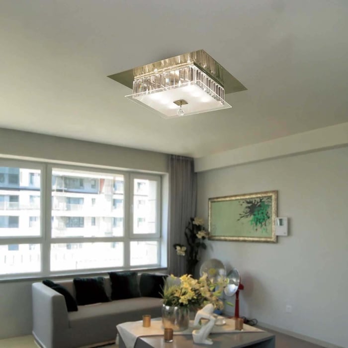 Sunlit living room with a square crystal flush ceiling light above the seating area.