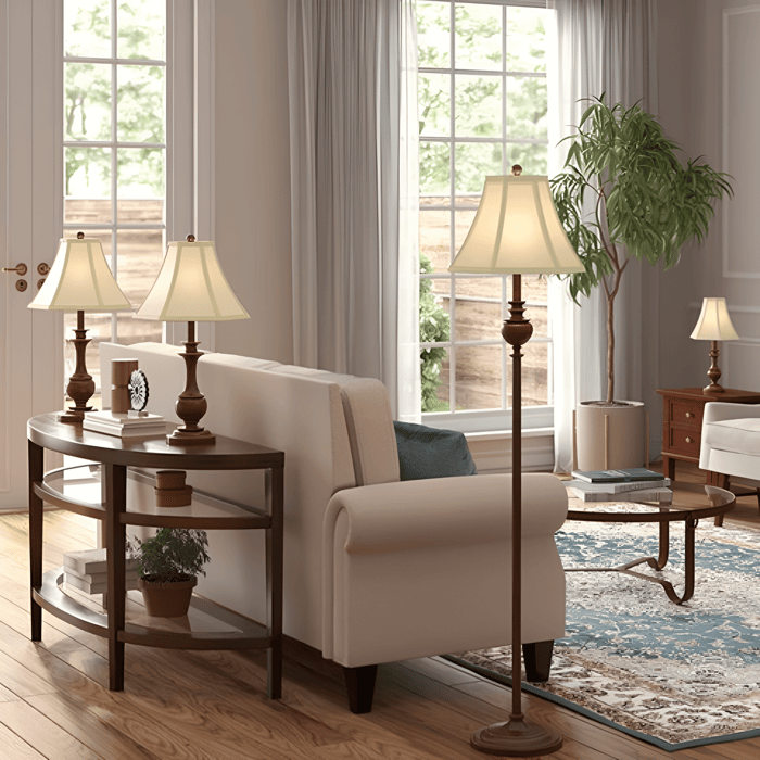 Bright living room with a beige sofa, wooden console and coffee table, traditional brass lamps, large windows, and a blue patterned rug.