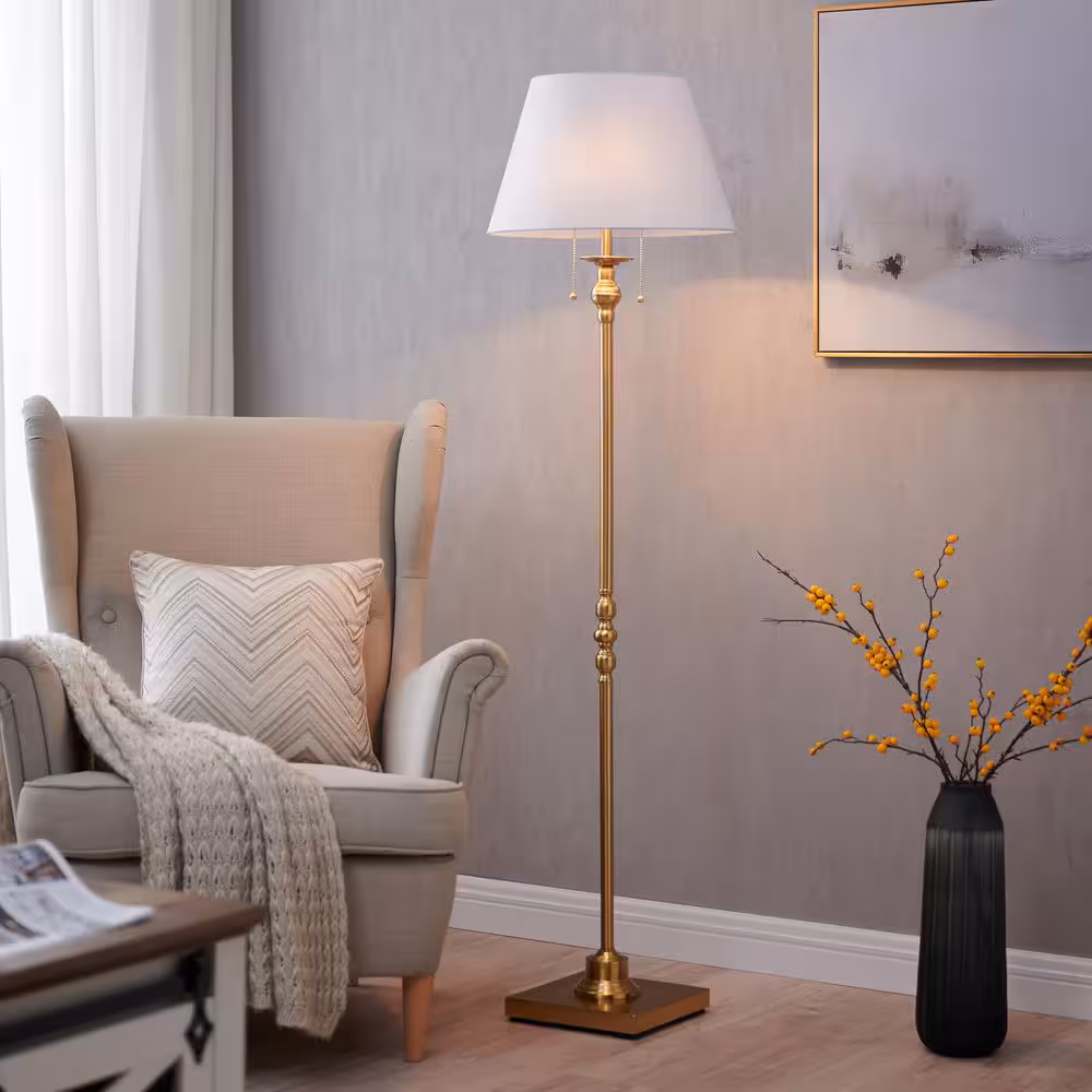 Traditional floor lamp with linen shade in a neutral living room.