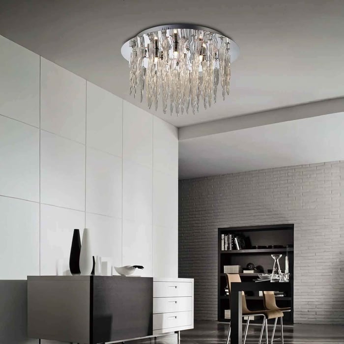 Minimalist dining space with a dramatic crystal icicle ceiling light as the main statement fixture.
