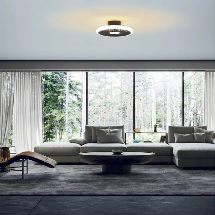 Modern living room with compact ceiling fan light, fireplace wall, and built-in shelving.