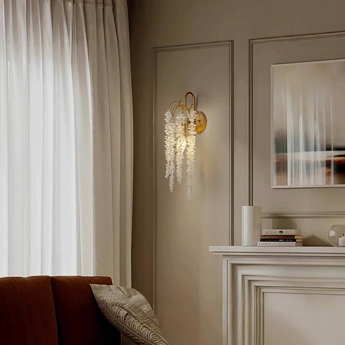 Wood slat feature wall with a square-shade wall light and adjustable reading arm above a bed or daybed.