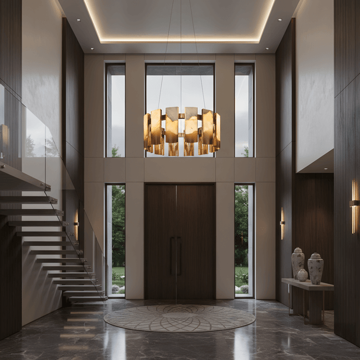 Grand double-height entryway with modern sculptural chandelier, floating staircase, and warm recessed ceiling lighting.