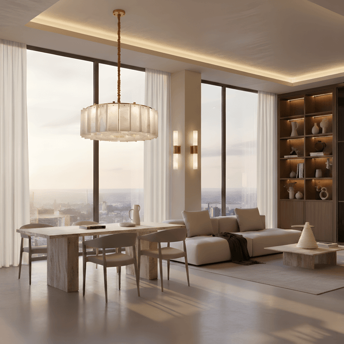 Modern open-plan living and dining area with circular alabaster chandelier and soft indirect ceiling lighting.