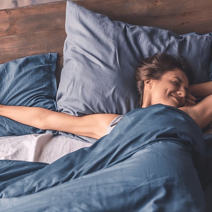 Woman wakes up refreshed with a wool duvet
