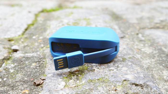 Open charging case revealing JLab Go Air earbuds