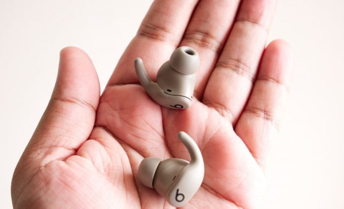 Rounded earbuds with flexible ear fins designed to grip