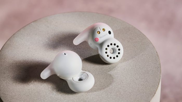 The distinct round earbuds and their unique open-ear ring design.
