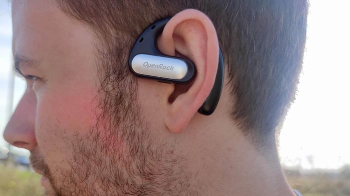 Comfortable and secure fit of the OpenRock Pro earbuds on the ear.