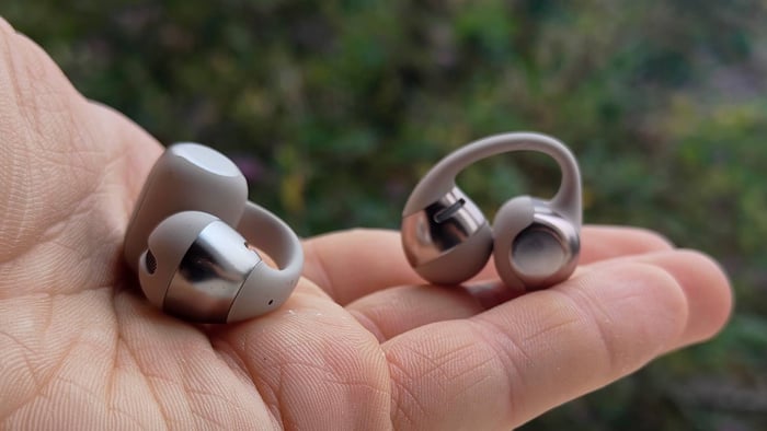 Holding the Shokz OpenDots One reveals their slim, ergonomic form.