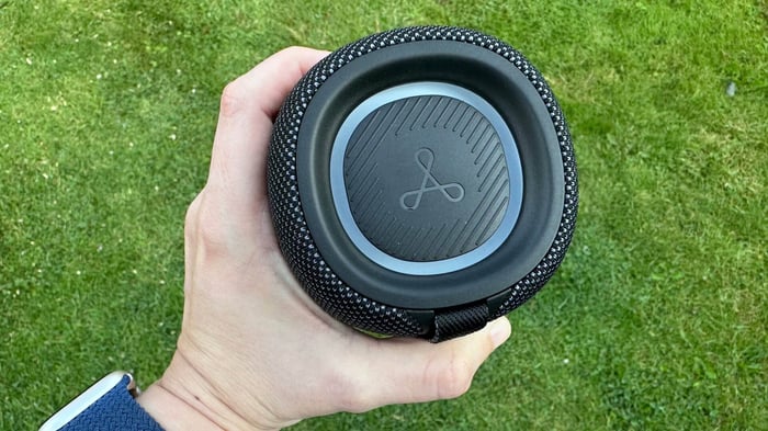 Close-up of the Tribit Stormbox Mini Plus’s top panel featuring tactile buttons and soft RGB lighting.