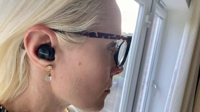 Technics EAH-AZ100 black earbuds held in hand