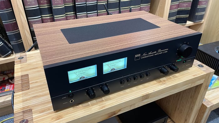 NAD C 3050 on a wooden Hi-Fi rack