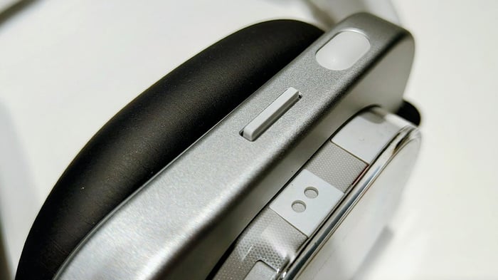 Close-up of the small ergonomic button on the side.