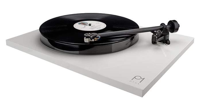 Vinyl playing with focus on the tonearm