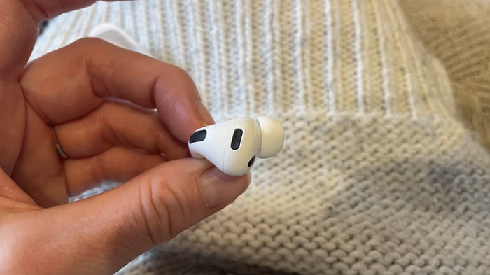 Apple AirPods Pro 3 held in hand