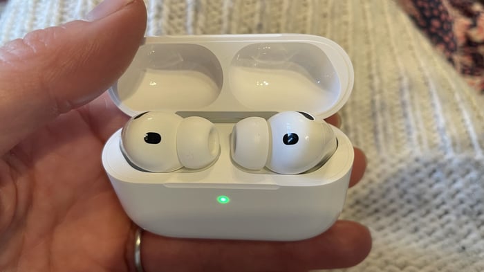 Apple AirPods Pro 3 held in hand
