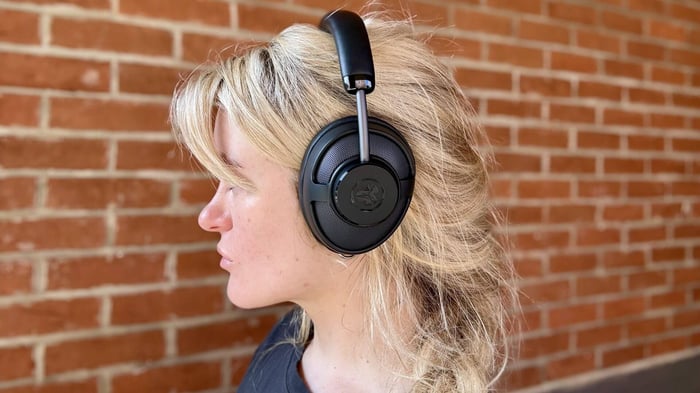 Reviewer Becca Caddy wearing JLab JBuds Open Wireless.