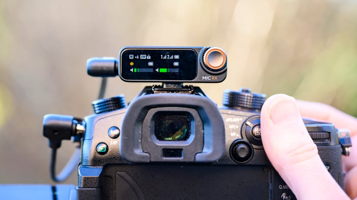 DJI Mic 2 receiver mounted to mirrorless camera