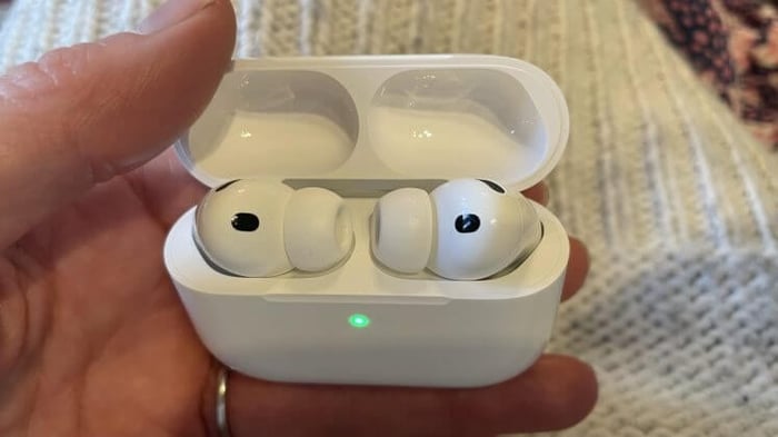 Apple AirPods Pro 3 held in hand