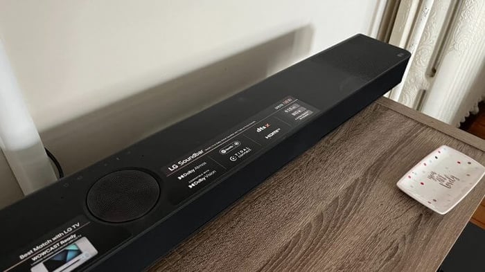 LG S95TR soundbar displayed on a table surface.