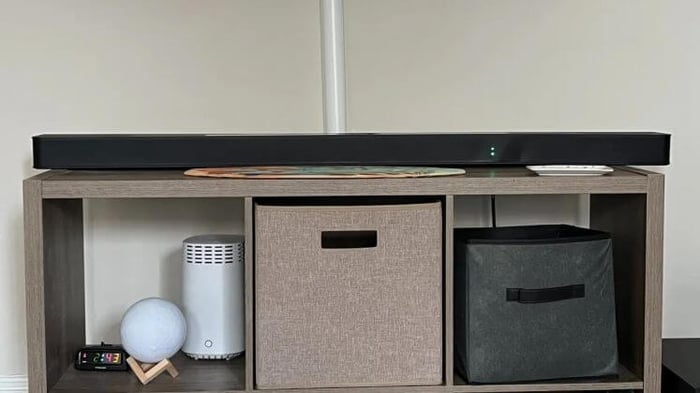 LG S95TR placed on shelving unit.