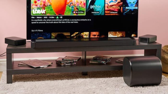 JBL Bar 1300MK2 with surround speakers and subwoofer.