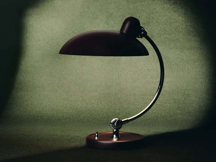 Burgundy lamp and turntable glowing warmly in a room