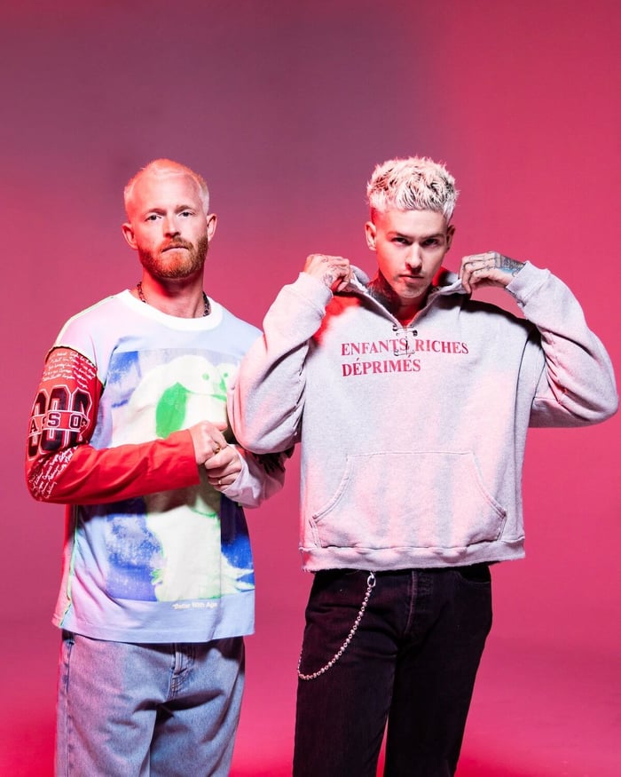 Nick Gross and Travis Mills collaborating in studio, blending old-school punk vibes with modern flair.