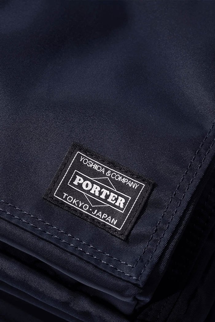 Porter bag close-up showing headphone loop and strap
