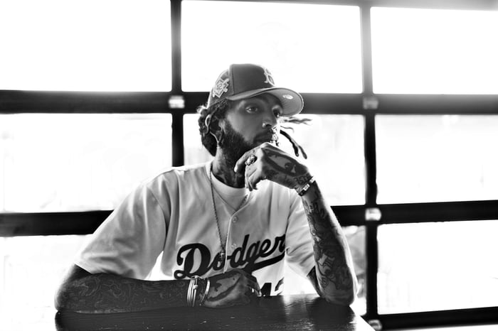 Travie McCoy sharing stories during the podcast