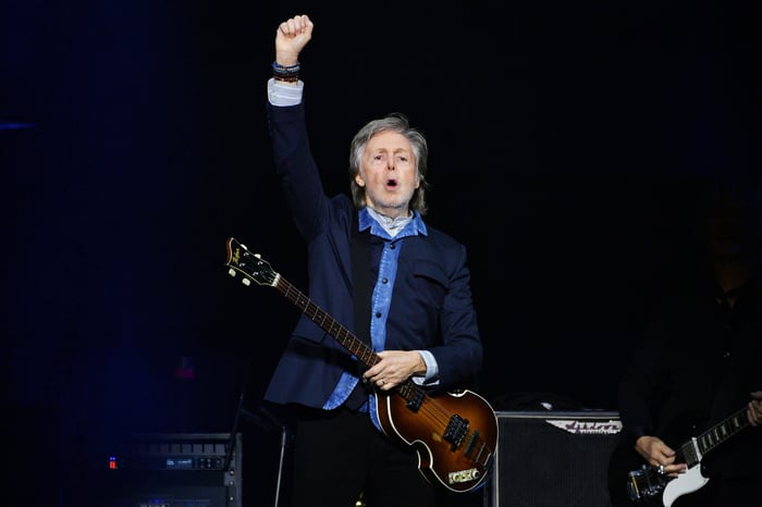 Paul McCartney performing on stage