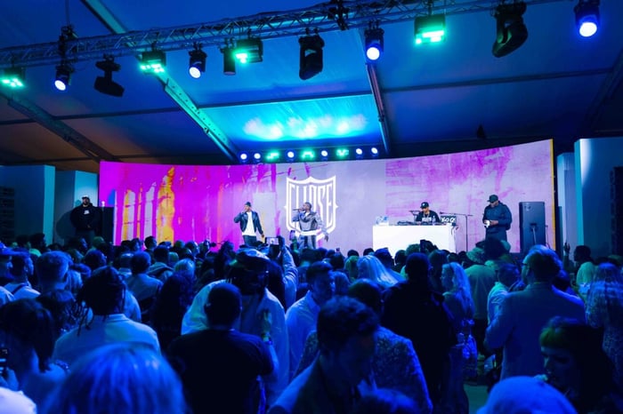 Kaz James spins vinyl, delivering a disco-fueled sunset soundtrack.