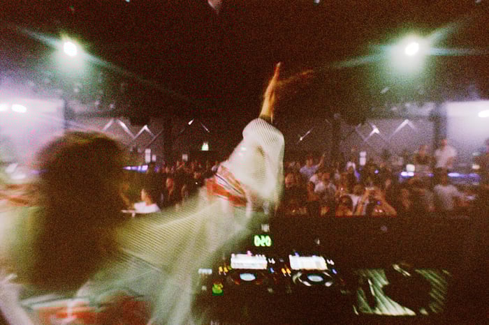 KLP vibing behind the decks, commanding the crowd.