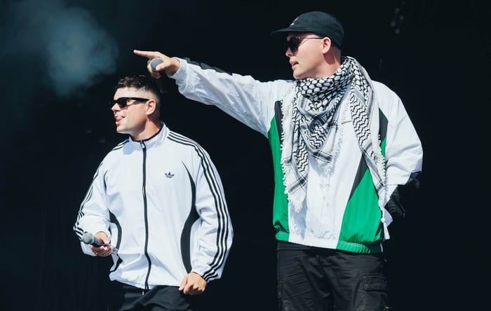 Kneecap's Mo Chara and Móglaí Bap perform at Glastonbury 2025, photo by Andy Ford