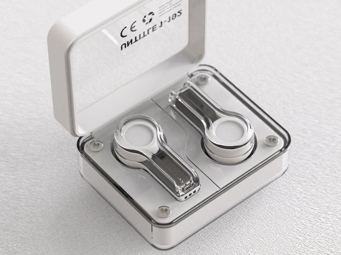 Close-up of earbuds showcasing smooth contours and potential touch surfaces.