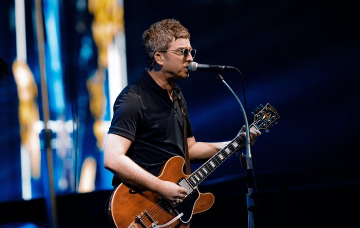 Noel Gallagher on stage during the Heaton Park finale.