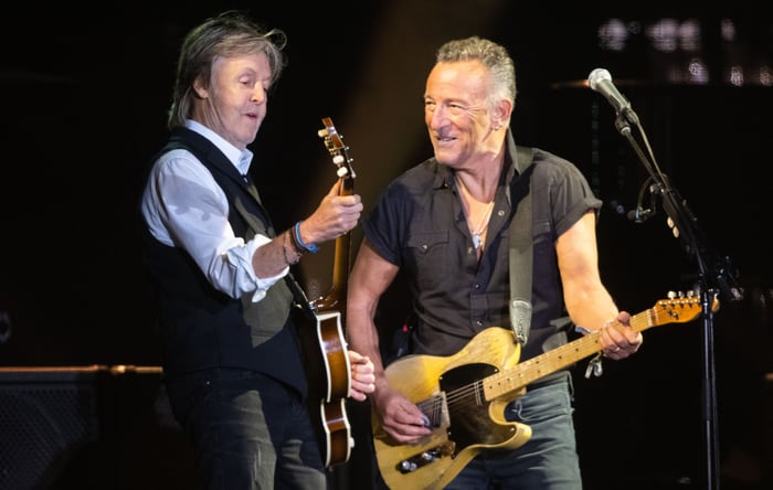 Paul McCartney and Bruce Springsteen performing in Liverpool