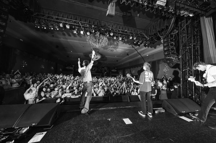 Fans reaching out towards the band during “Come a Little Closer”