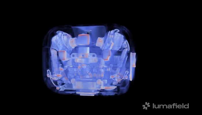 Internal view of AirPods Pro 3 teardown showing glued components