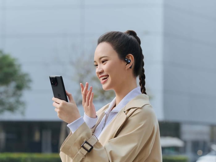 Final product shot of ASUS ROG Cetra Open Wireless earbuds with packaging