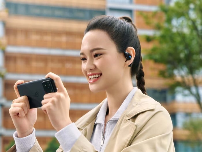 ROG Cetra Open Wireless earbuds in their charging case, highlighting design and controls