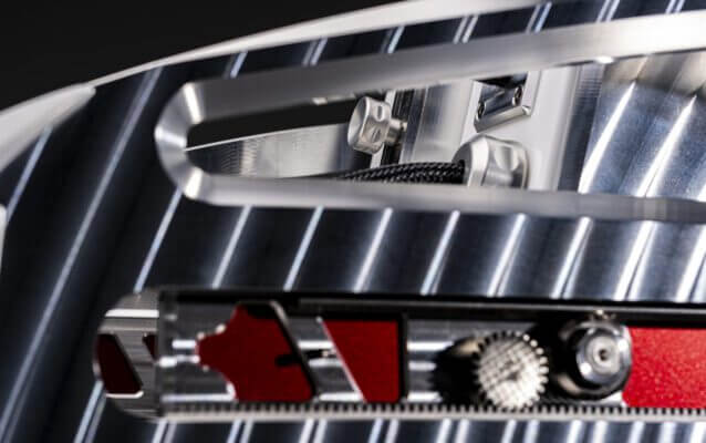 Precision slide-spike mechanisms secure the speaker, ensuring stability and vibration control.