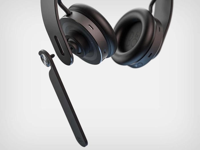 Charging base with headphone draped in an elegant arc