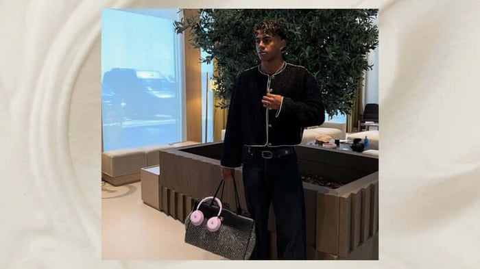 Lamine Yamal showing off a striking new pair of Beats headphones in eye-catching pink.
