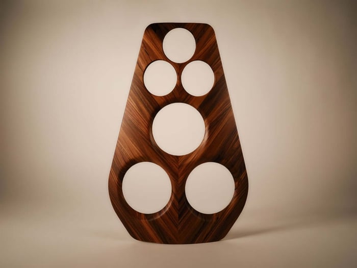 The speaker's organic, pearl-inspired texture captures light throughout the day