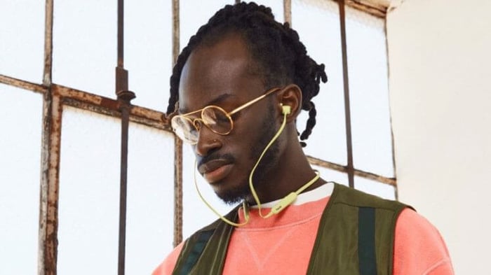 Beats Flex earbuds on a surface