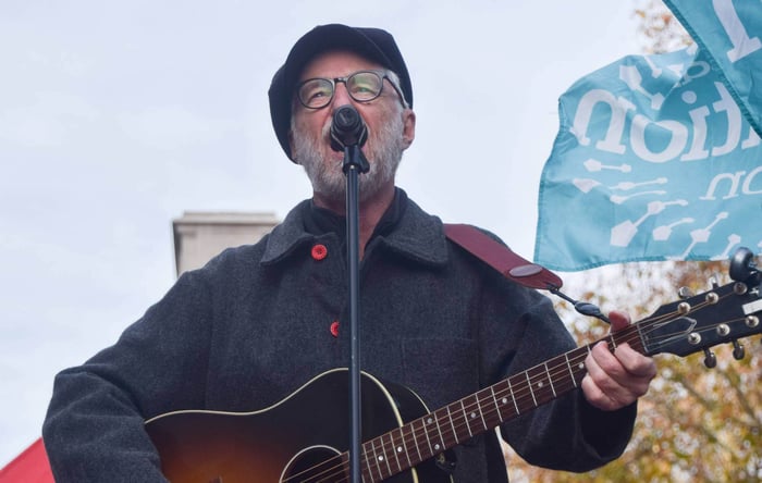 Billy Bragg performing at the London protest