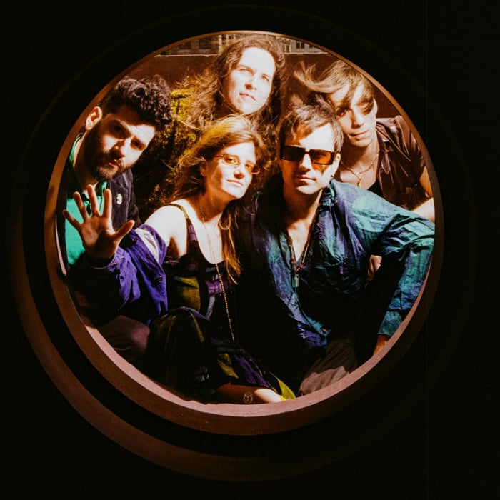 Bodega members posing together in a square portrait